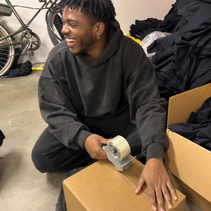 Marcus taping a box