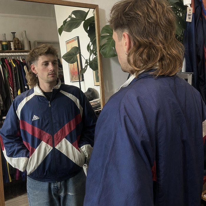 Vintage shop owner with a customer